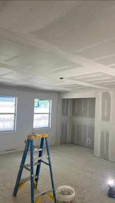 Handyman performing light electrical work and finishing touches