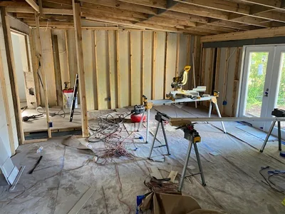 Handyman installing new drywall panels