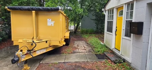 Champs dumpster set in front of a Windermere home during a roof repair