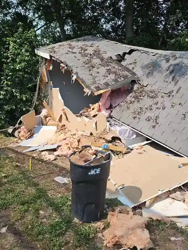 Removing the roof from a shed during a Eustis, FL teardown