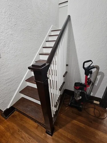 Restained banister and treads on the lower staircase in Winter Park