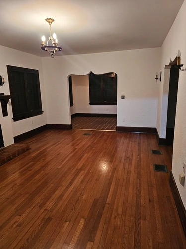 Side view of the remodeled fireplace and built-in shelving in Orlando